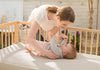 satara-home-naturepedic-organic-breathable-ultra-2-stage-chemical-free-crib-mattress-mom-with-baby-lifestyle-image