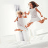 Girls-jumping-on-Naturepedic-organic-mattress