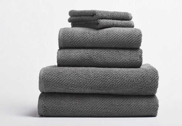 https://www.satarahome.com/cdn/shop/products/satara-home-organic-all-natural-coyuchi-air-weight-bath-towels-slate-image_2000x.jpg?v=1617899093